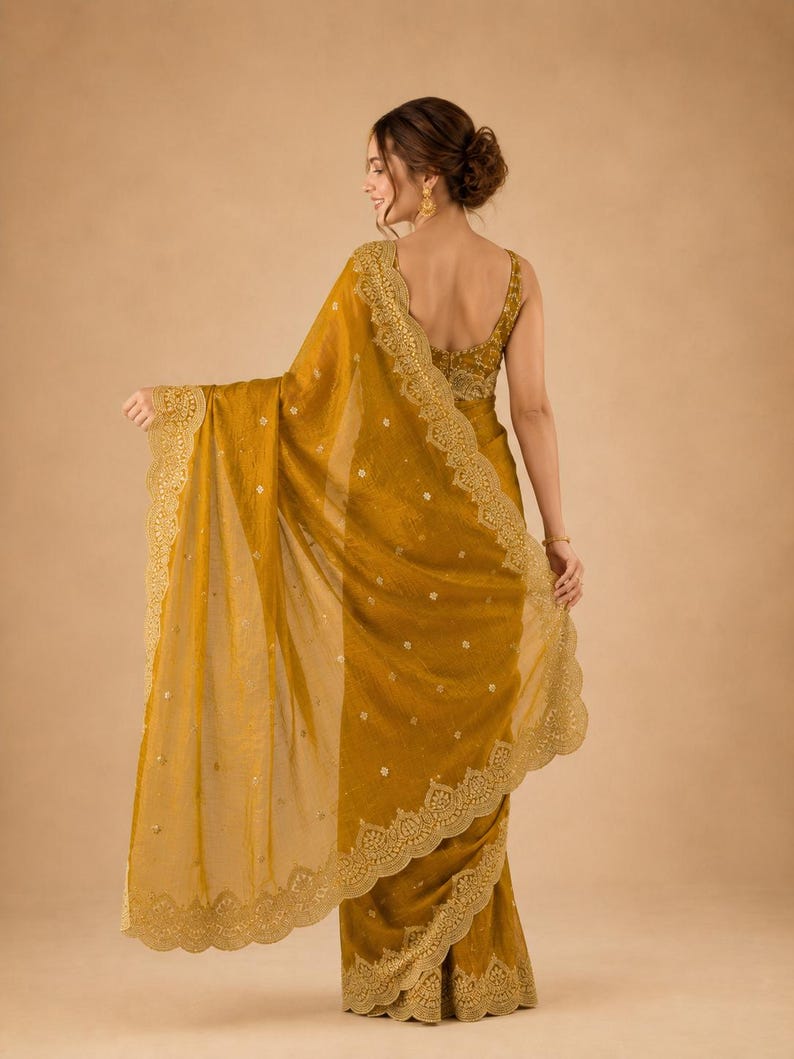Back pose of Women wearing golden Embroidered Fendy Chiffon Saree for wedding, Party wear Outfit for UK Girls