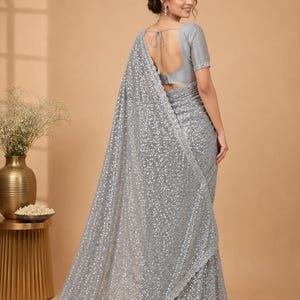 Fancy glitter saree in soft grey with matching blouse and festive designer aesthetic