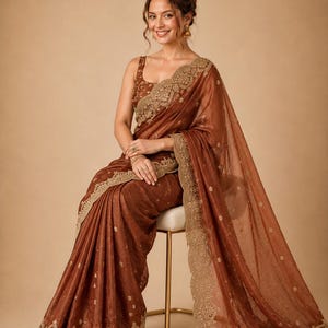 Sitting pose of Women wearing Brown Embroidered Fendy Chiffon Saree for wedding, Party wear Outfit for UK Girls