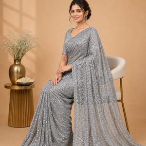 Modern met grey shimmer saree with lightweight net texture and glamorous evening appeal