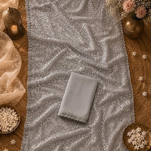 Grey party wear saree with shimmering sequins and graceful silhouette for weddings and festive nights