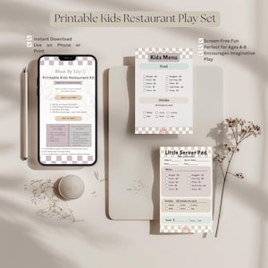 May include: A printable kids restaurant play set, including a menu, server pad, and a phone displaying the kit's contents. The set features a neutral color palette with a checkered pattern and the text "Kids Menu" and "Little Server Pad".