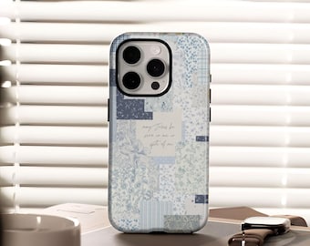 May include: A phone case with a patchwork design in shades of blue and white. The case features a floral pattern, grid patterns, and a handwritten quote that reads "may Jesus be seen in me in spite of me."
