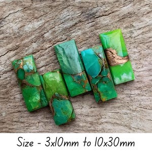 May include: Six rectangular green and turquoise stones with copper-coloured veining. The stones vary in shades of green and turquoise. The text at the bottom of the image reads "Size - 3x10mm to 10x30mm".