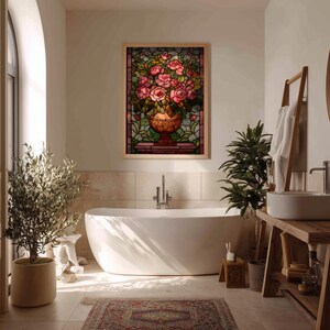 May include: A framed stained glass artwork depicting a vase overflowing with pink roses. The artwork is set against a backdrop of green foliage and is displayed in a bathroom setting with a white bathtub, plants, and wooden accents.