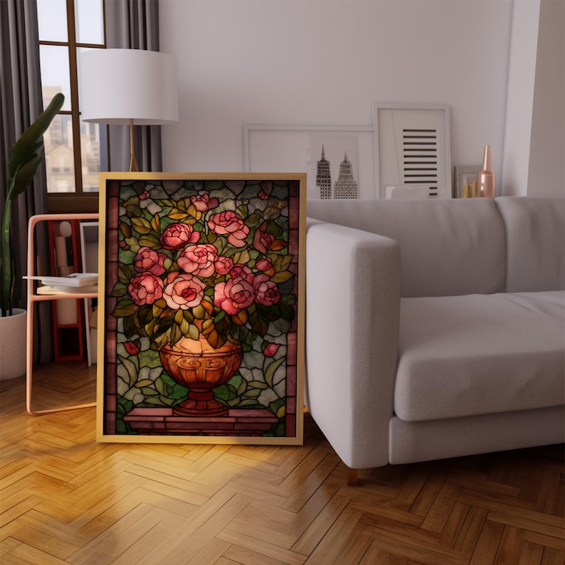 May include: A framed stained glass artwork featuring a vase overflowing with pink roses. The vase is a warm copper color, and the background is a mosaic of green and amber glass. The frame is gold.