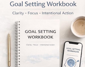 May include: A white spiral-bound "Goal Setting Workbook" with the text "Clarity, Focus, Intentional Action." A gold pen, a smartphone displaying the workbook cover, and a cup of coffee are also present.
