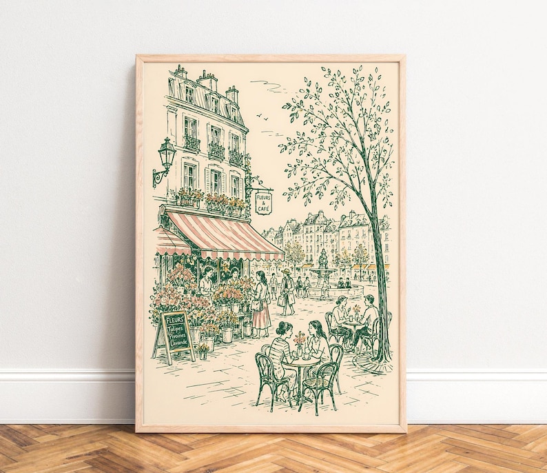 Puede incluir: Una l&aacute;mina enmarcada con un dibujo lineal de una escena callejera parisina con una florister&iacute;a y una cafeter&iacute;a. La ilustraci&oacute;n muestra personas sentadas en mesas, una fuente al fondo y un cartel que dice Fleurs & Caf&eacute; en tinta verde.