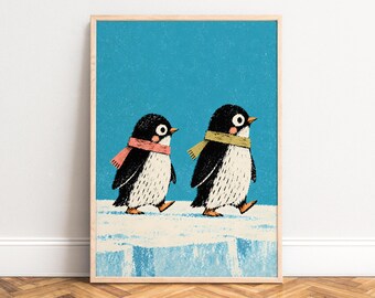 May include: A framed art print featuring two illustrated penguins walking on a white icy surface against a solid blue background. The left penguin wears a pink scarf, and the right penguin wears a yellow scarf. Both have black and white feathers.