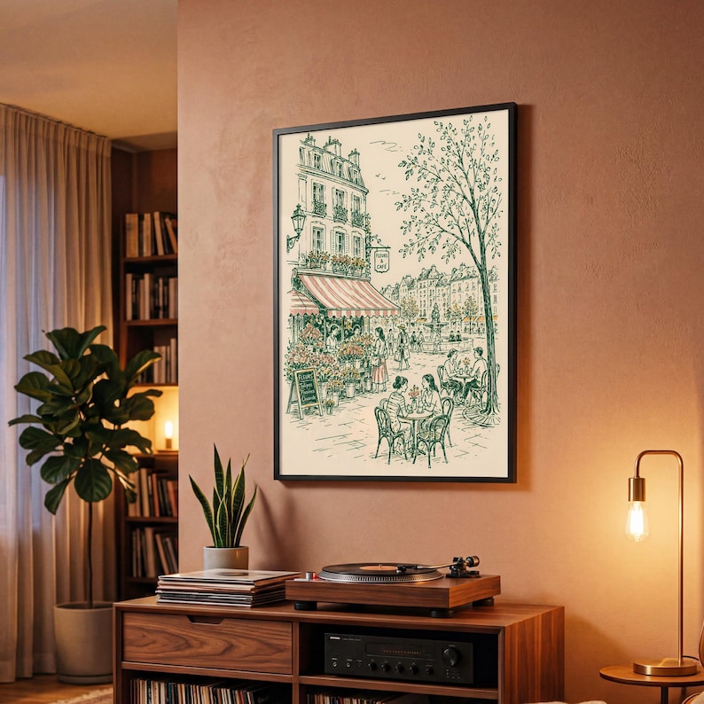 Puede incluir: Una l&aacute;mina de arte enmarcada con un dibujo lineal detallado de una escena callejera parisina con un caf&eacute;, una florister&iacute;a y personas sentadas en mesas al aire libre. La ilustraci&oacute;n utiliza tinta verde sobre un fondo crema.