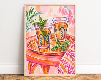 May include: A framed painting depicts two clear glasses filled with amber liquid and fresh green mint sprigs, resting on a round gold-toned metal tray. The tray sits atop a bright pink and orange table, accompanied by a patterned fabric.