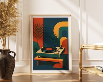 May include: A framed art print featuring a retro-style illustration of a record player. The artwork uses a palette of teal, orange, and green. The record player sits on a geometric stand, with a dark record on the turntable.