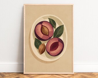 May include: A framed vertical art print featuring a light beige background with a central illustration of two halved dark purple plums on a cream-colored plate. The image includes two brown fruit pits and three dark green leaves arranged around the fruit.
