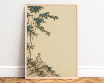 May include: A framed wall art print featuring a person in a robe sitting on a rocky cliffside under tall bamboo stalks. The illustration uses muted green and beige tones, depicting a figure in profile against a large, empty cream-colored space.