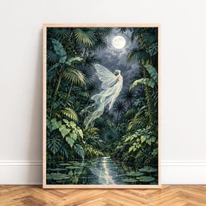 May include: A framed wall art print depicting a winged figure floating above a dark jungle stream under a full moon. The scene features lush green tropical foliage, palm trees, and lily pads on the water surface, all rendered in deep tones.