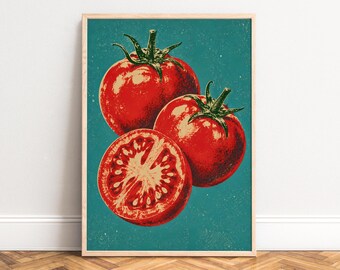 May include: A framed wall art print featuring a graphic illustration of two whole red tomatoes and one sliced tomato half. The tomatoes have green stems and are set against a solid teal background with a subtle, distressed texture.