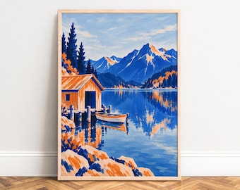 May include: A vertical art print in a light wood frame depicting a landscape with a small orange boat house on a wooden dock, a white and orange boat, a calm blue lake, and snow-capped blue mountains under a bright sky with orange trees.
