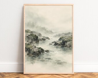 May include: A vertical framed wall art print featuring a watercolor landscape of a misty river flowing between rocky, moss-covered banks in muted shades of green, gray, and beige, enclosed in a light-toned wooden frame.
