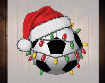 May include: A soccer ball illustration wearing a Santa hat and adorned with colorful Christmas lights. The soccer ball is black and white, and the Santa hat is red with white trim. The image includes the text "Ready for Press" and "Dtf Transfers".