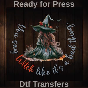 May include: A digital transfer design featuring a witch in a green dress and hat, with long red hair. The text reads "You say Witch like it's a bad thing." The background is a dark wood grain.