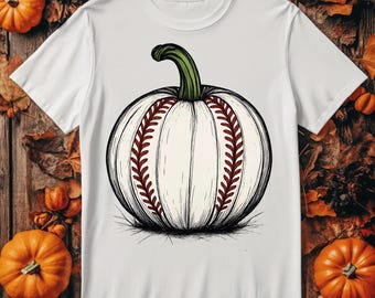 May include: White t-shirt featuring a unique graphic of a pumpkin designed like a baseball. The pumpkin has a green stem and is detailed with baseball stitching in a dark red color. A fun and festive design for fall and baseball fans.
