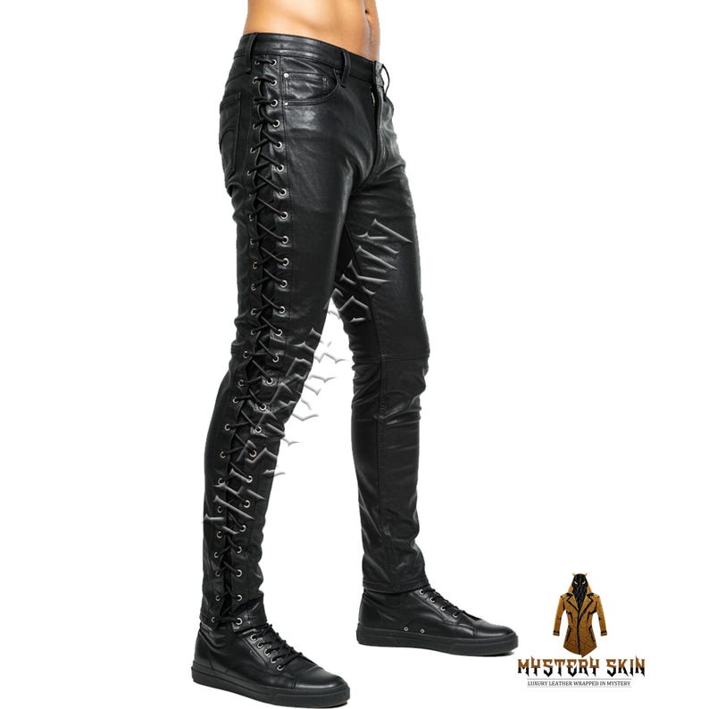 May include: Black leather trousers featuring lace-up detailing on the side. The slim-fit trousers are worn with black trainers. The image is set against a white background, emphasizing the texture and design of the leather.