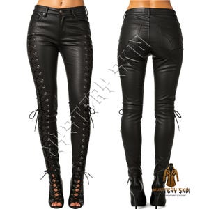 May include: Black faux leather pants with lace-up detailing on the sides. The pants have a fitted silhouette and are shown from the front and back. The front view displays the lace-up design, while the back view shows the back pockets.