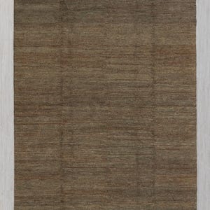 May include: A brown rectangular rug with a textured surface and fringed edges. The rug measures 240x300 cm. The rug has a simple, neutral design, suitable for various interior styles. The rug's color is a warm, earthy tone.