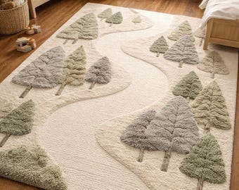 May include: A cream-colored area rug with a forest design. The rug features a winding river-like path and textured trees in shades of green and gray. The rug is placed on a hardwood floor in a child's bedroom.