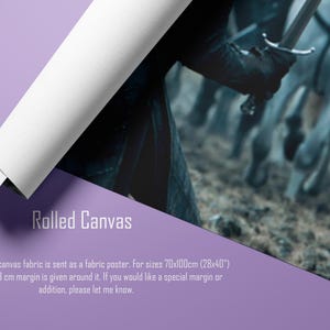 May include: Rolled canvas print featuring a scene with a person holding a sword, with horses in the background. The canvas is rolled up, revealing the image. The text "Rolled Canvas" is visible.