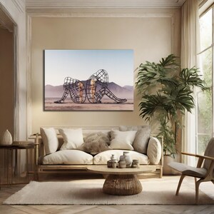 May include: A canvas print featuring a wireframe sculpture of two figures embracing. The sculpture is set against a desert landscape with mountains and a blue sky. The figures are filled with a warm, golden light.