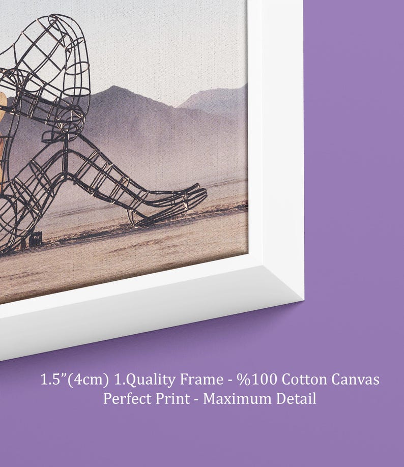 May include: White framed canvas art print featuring a wireframe sculpture of a person sitting on a beach. The background shows mountains and a hazy sky. The frame is 1.5 inches (4cm) thick. The text on the frame says "Perfect Print - Maximum Detail."