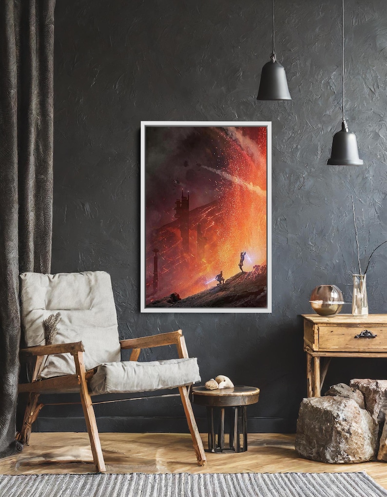 May include: Framed artwork depicting a dramatic, fiery scene with silhouetted figures on a rocky landscape. The artwork is set against a dark, textured wall, with a wooden chair and side table in the foreground. Two pendant lights hang from the ceiling.