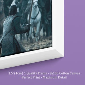 May include: A framed canvas print depicting a battle scene with figures on horseback and a warrior holding a sword. The frame is white, and the canvas has the text "1.5"(4cm) 1.Quality Frame - %100 Cotton Canvas Perfect Print - Maximum Detail".