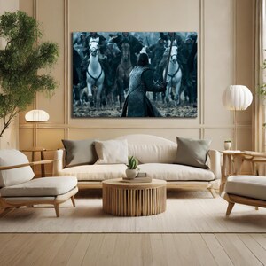 May include: A large canvas print depicting a battle scene with mounted soldiers. The artwork features a central figure in armor facing a charge of riders on horseback. The color palette is dominated by cool tones.