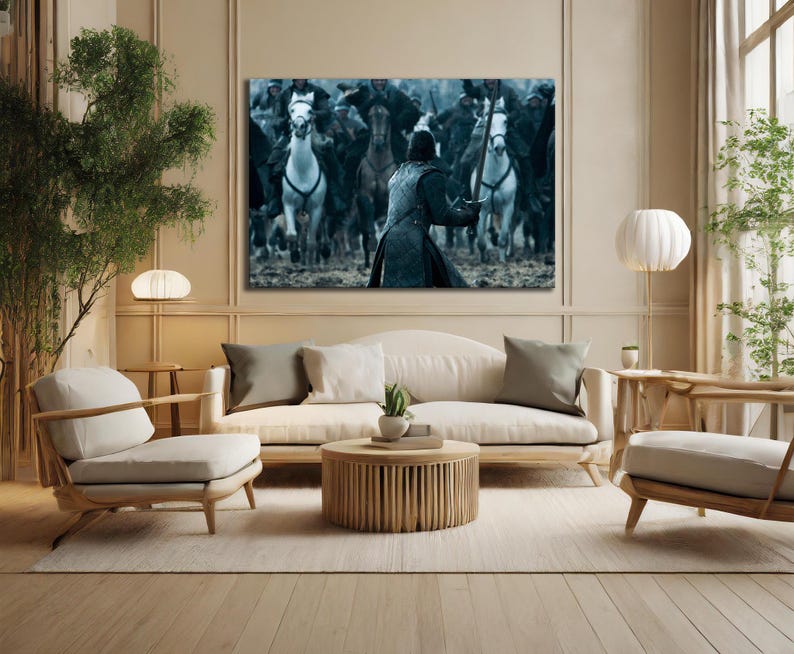 May include: A large canvas print depicting a battle scene with mounted soldiers. The artwork features a central figure in armor facing a charge of riders on horseback. The color palette is dominated by cool tones.
