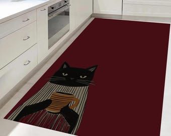 Puede incluir: Alfombra de cocina burdeos con un gato negro sosteniendo una taza de café. El gato lleva un suéter a rayas. La alfombra tiene forma rectangular y está diseñada para la cocina.