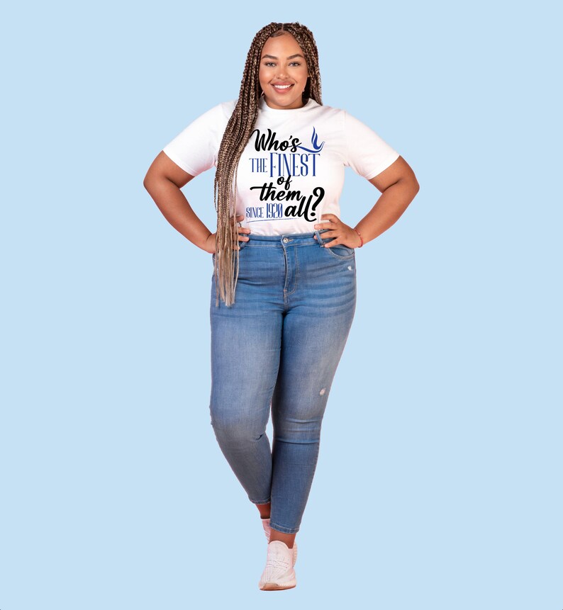 May include: A white short-sleeve t-shirt featuring the blue and black text Who's THE FINEST of them all? SINCE 1908 and a small blue bird icon, paired with blue denim jeans and white sneakers, creating a casual outfit for everyday wear.