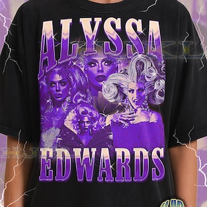 May include: Black adult unisex t-shirt with a purple graphic of Alyssa Edwards. The design includes multiple images of Alyssa Edwards with the name in large purple letters. The shirt also has the text "ADULT Unisex Shirt : BLACK".
