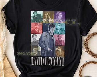 May include: Black adult unisex t-shirt featuring a collage of images of David Tennant. The design includes various portraits of the actor, with the name "DAVID TENNANT" printed in white below the images. The shirt also has the text "ADULT Unisex Shirt : BLACK".