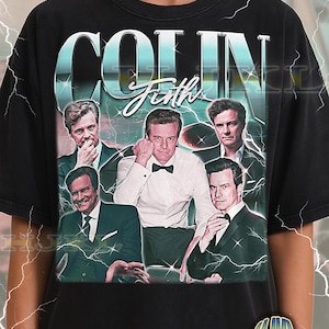 May include: Black adult unisex t-shirt featuring a collage of images of Colin Firth. The design includes the name "COLIN Firth" in a stylized font, with a vintage aesthetic. The shirt has a distressed look.
