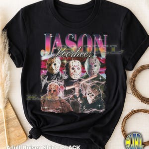 May include: Black adult unisex t-shirt featuring a graphic of Jason Voorhees and his hockey mask. The design includes the text "JASON Voorhees" in a colorful, retro font. The shirt is a classic crew neck.