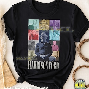 May include: Black adult unisex t-shirt featuring a collage of images of Harrison Ford. The design includes a central portrait and several smaller images, with the name "HARRISON FORD" in white block letters. The shirt also has the text "Adult Unisex Shirt : BLACK".