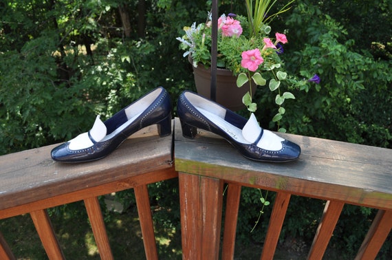 women's navy and white spectator pumps
