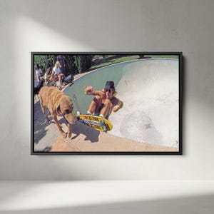 May include: A framed photograph captures a skateboarder in action inside a pool, with a yellow skateboard. A brown dog walks nearby. The image has a vintage aesthetic, with people in the background.