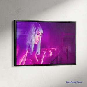 May include: A framed canvas print featuring a futuristic, neon-lit scene. A woman with blue hair and a finger pointed forward is the focal point. A figure stands in the background. The canvas is in a black frame.