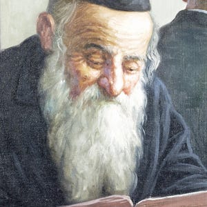 May include: An oil painting depicts an elderly man with a long white beard and a black hat, engrossed in reading a book. The man is wearing a dark coat, and another figure is partially visible in the background.