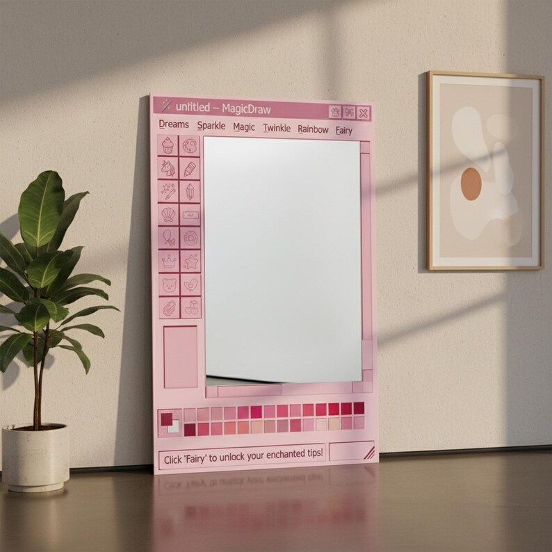 May include: A pink framed mirror designed to resemble a computer window, with the text "untitled - MagicDraw" at the top. The mirror has a grid of icons on the left and a color palette at the bottom. The text "Dreams Sparkle Magic Twinkle Rainbow Fairy" is also visible.