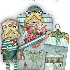 May include: A whimsical paper doll and tag set featuring frog characters in sailor and Victorian attire. The set includes a frog in a sailor suit, a frog in a pink dress, and a tag with the text "Little Folks" and a butterfly illustration. The background has a light blue striped pattern.