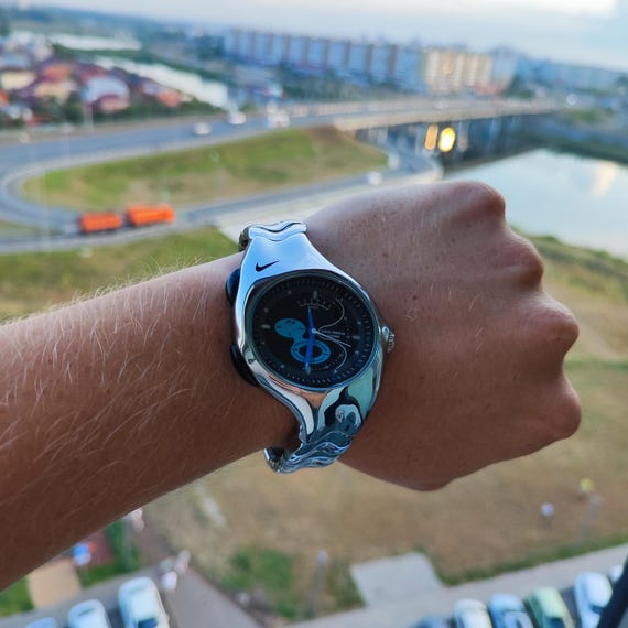 Futurist Chrome Curve Watch – Retro Y2K Liquid Metal Style by Nike